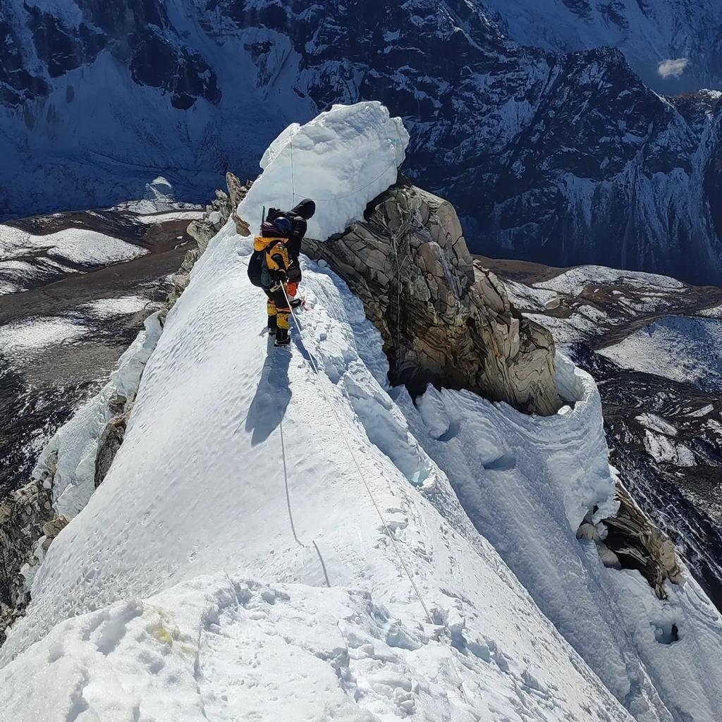 Sherpa guide looking at Ama Dablam